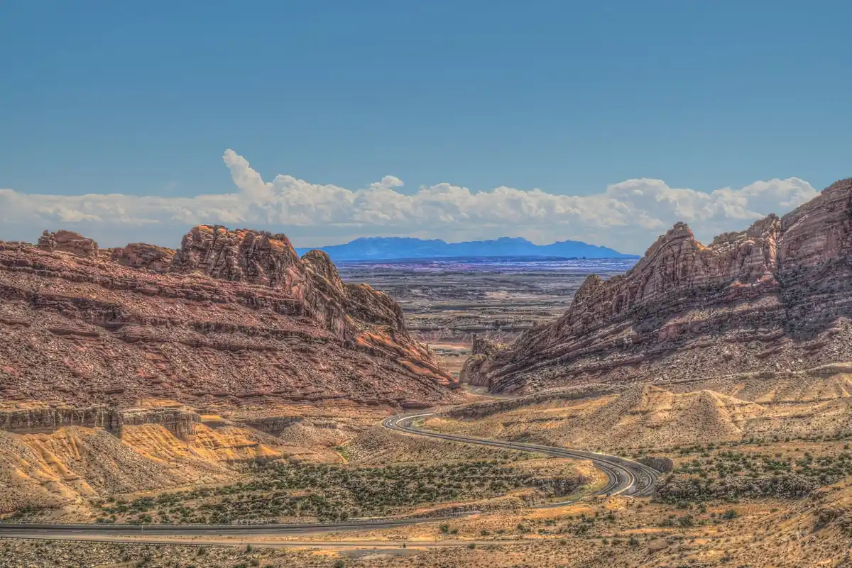 Interstate 70 cutting through the red walls of Spotted Wolf Canyon in the San Rafael Swell