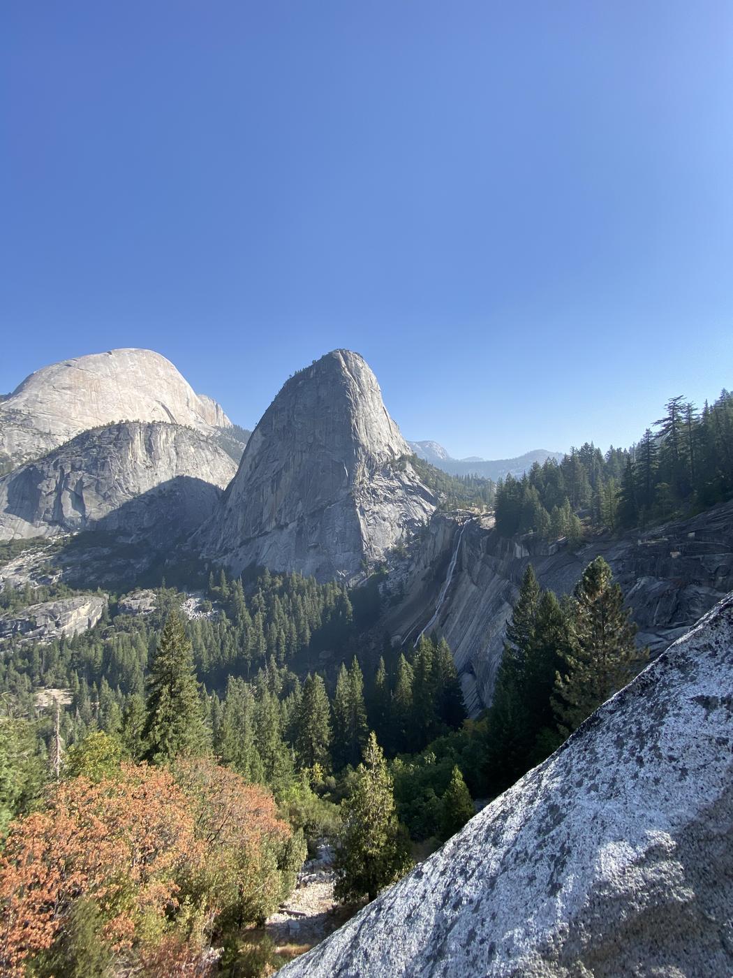 Liberty Cap and Nevada Fall seen from the trail above the Merced River, Yosemite