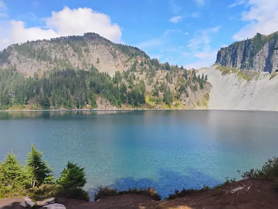 The turquoise water of Iceberg Lake on the Chain Lakes Loop below Mount Baker