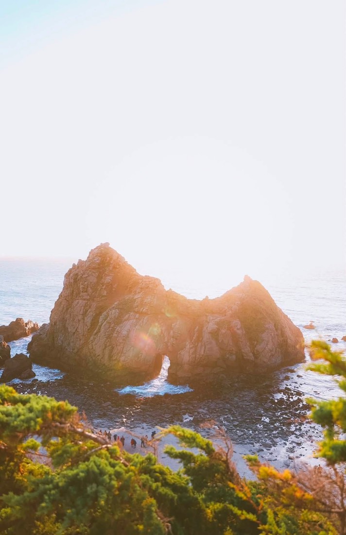 Keyhole Rock at Pfeiffer Beach backlit by the setting sun